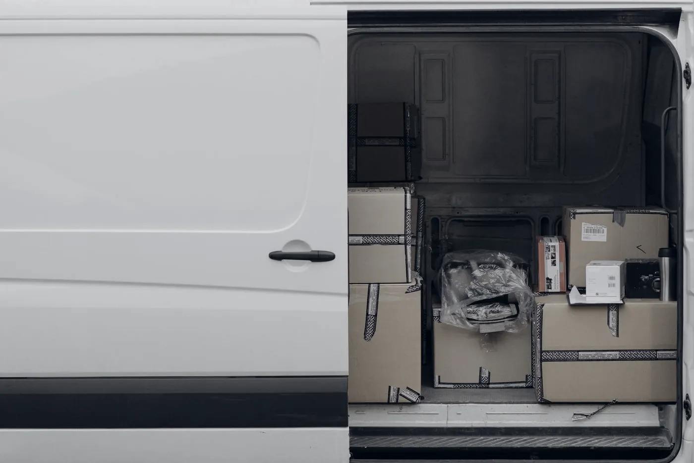 Open delivery van loaded with parcels